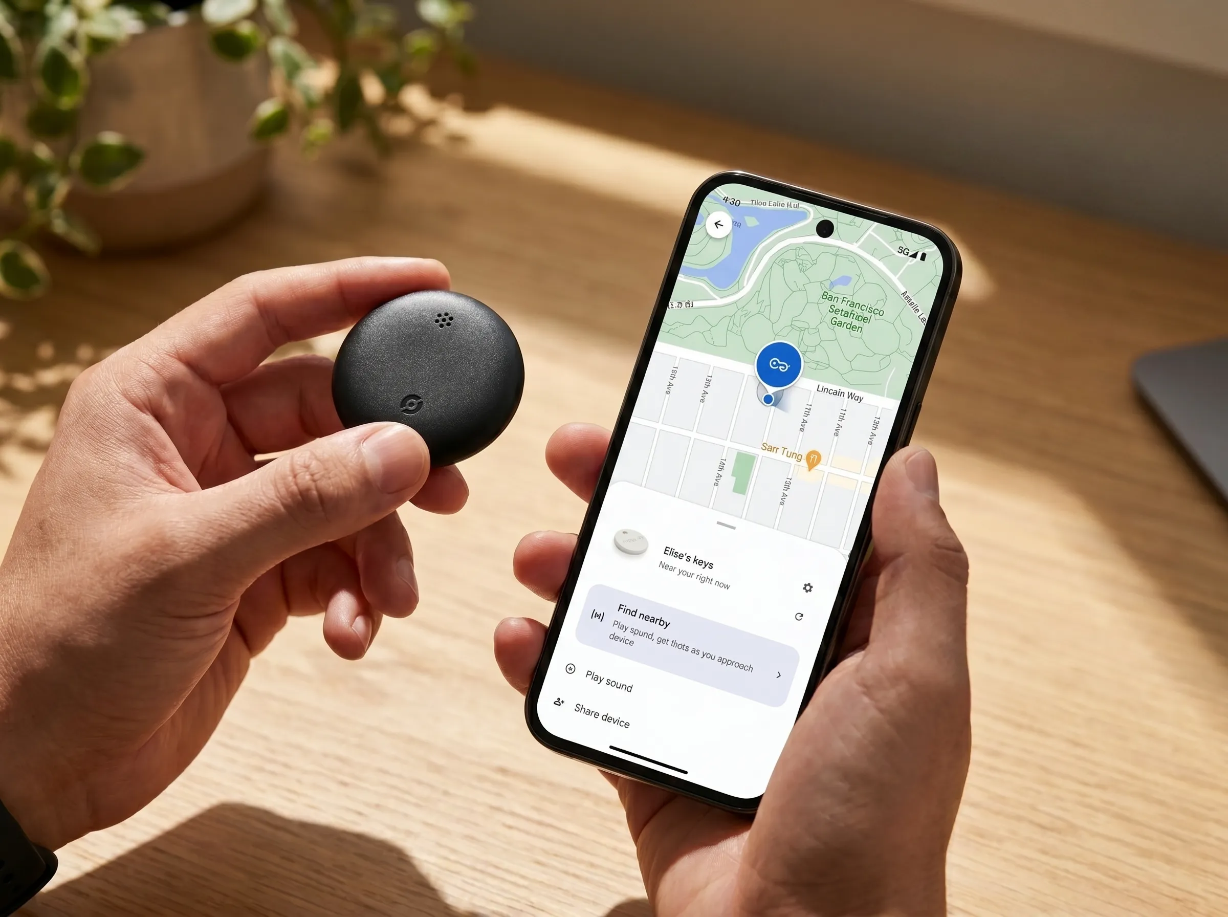 Android Airtag held in hand — setup view